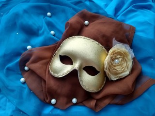 Golden mask on the two color fabric