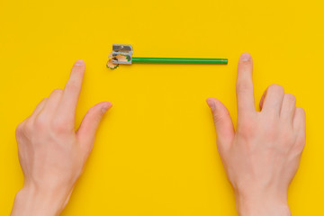 persons hand sharpening a pencil isolated b