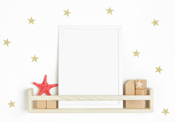 The blank poster on the wooden shelf with star-shaped stickers on the wall