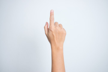 Woman hand pointing at something on a white background.