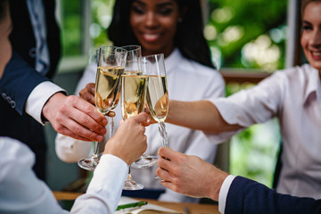 Clinking glasses of champagne. Business concept