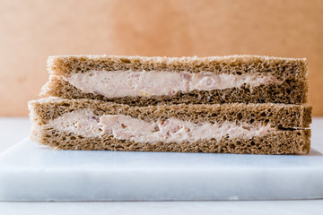 Triangle Light Sandwich with Tuna Fish Paste on Marble Board.