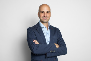 Cheerful handsome bald man smiling. Isolated