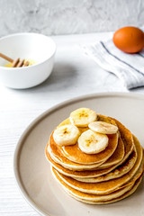cooked pancake on plate at wooden background