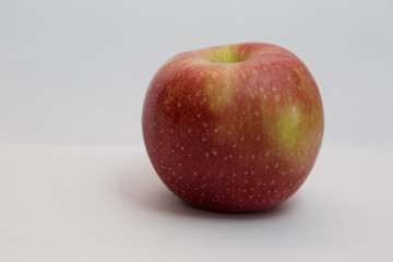 Isolated apple fruit on white background side view