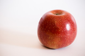 Isolated apple fruit on white background side view