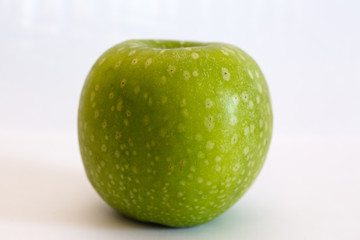 Isolated apple fruit on white background side view