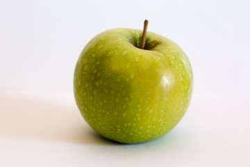 Isolated apple fruit on white background side view