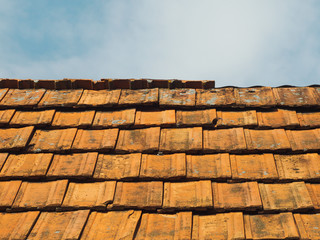 Roof tiles on a background of blue sky