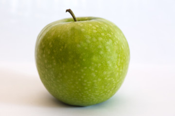 Isolated apple fruit on white background side view