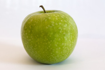 Isolated apple fruit on white background side view