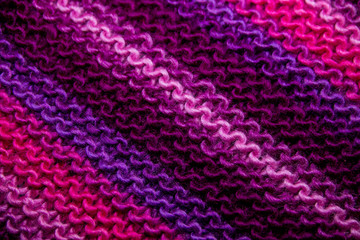 Pink, white and violet striped knitted texture background