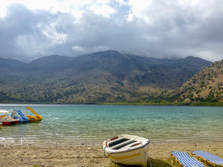 Freshwater lake Kournas with recreation equipment in Crete, Greece
