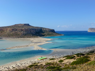 Fototapeta na wymiar Famous lagoon of Balos beach with white sand and exotic blue and turquoise waters on Crete island, Greece