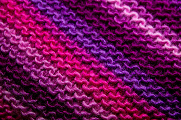 Pink, white and violet striped knitted texture background