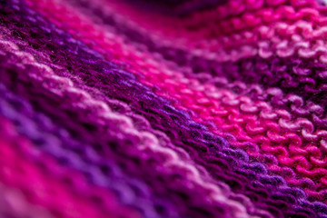 Pink, white and violet striped knitted texture background