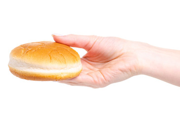 Burger bun in hand on a white background. Isolation