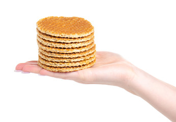 Waffles with caramel in hand on a white background. Isolation