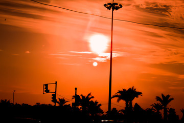 A sunset view on a cloudy day on a highway.