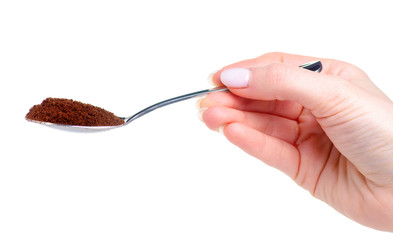 spoon with coffee in hand on white background isolation