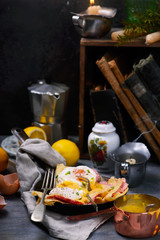 crepes with sausage and benedict eggs. selective focus