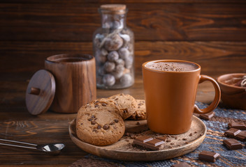 Cup with tasty coffee on table