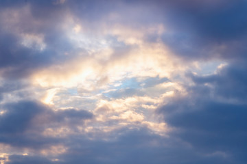Blue sky among dark clouds. Cloudy landscape
