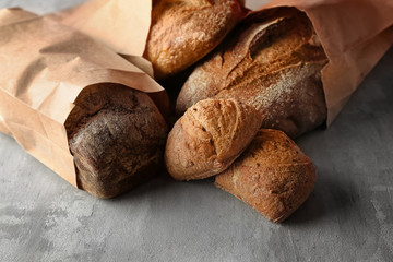 Assortment of tasty bakery products on grey background