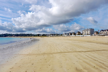 Beach under a cloudy sky in Saint-Cast-le-Guildo, a commune in the Côtes-d'Armor department of Brittany in northwestern France