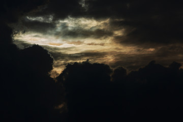 heaven light in dramatic sky with dark cloud