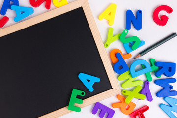 Colorful Alphabet On A Blackboard Or Chalkboard
