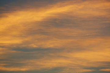 Naklejka na ściany i meble golden sunlight shiny through cloud on dramatic dusk sky