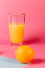 Close up of range juice on colorful background.