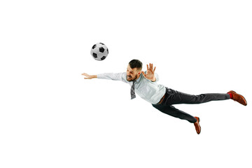 Fototapeta premium Full length shot of a young businessman playing football isolated on white background.