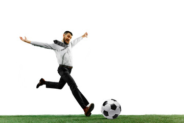 Full length shot of a young businessman playing football isolated on white background.