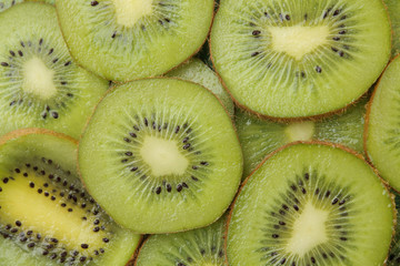 background of kiwi fruit. A lot of ripe kiwi fruit slices. close-up. view from above