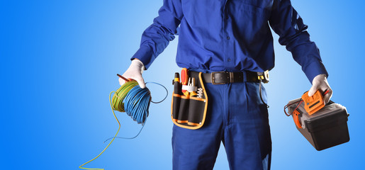 Background uniformed electrician with tools and electrical equipment only body