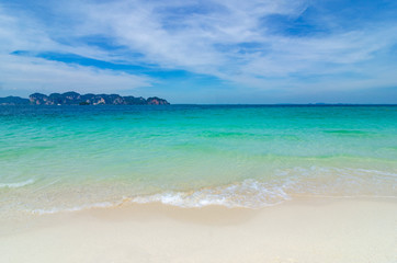 White beach on a clear blue sky, blue sea