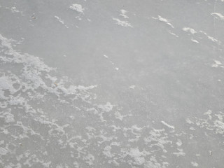 Snow on the ice of the river. Frozen river. Ice on the river.