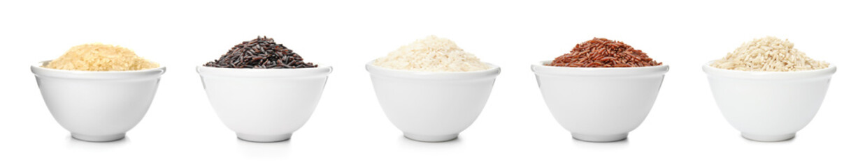 Set of bowls with different uncooked rices on white background