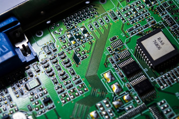 The motherboard of green color from the personal computer. Repair. Texture or background. Electronics. Spare parts. 
