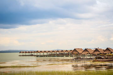 Fototapeta premium Floating food shop on the Sirindhorn Dam at Pattaya Noi (Little Pattaya) beach, a stretch of golden sand along the northern shore where you can swim or get whipped around on a raft pulled by a jet ski