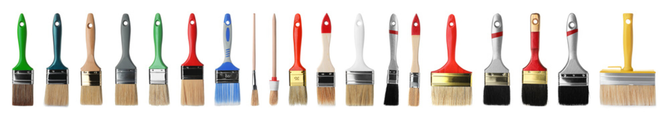 Set of different clean paint brushes on white background