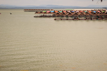Jet skies and water activities including floating food shop at Pattaya Noi beach in Sirindhorn Dam,...