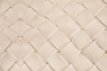 White plaited leather surface as background, closeup