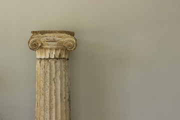 antique marble column from ancient Greece times exhibit object on white wall background texture...