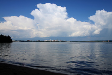 Naklejka na ściany i meble clouds over lake