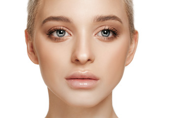 Fototapeta premium The beautiful female face. The perfect and clean skin of face on white. The beauty, care, skin, treatment, health, spa, cosmetic concept