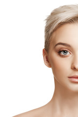 Fototapeta premium The beautiful female face. The perfect and clean skin of face on white. The beauty, care, skin, treatment, health, spa, cosmetic concept