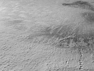 Snow on the ice of the river. Frozen river. Ice on the river.